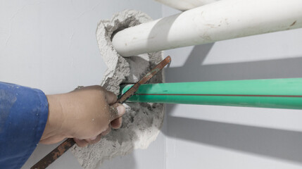 Fototapeta na wymiar Instalation ppr pipe on indoor.cuting the ppr pipe 