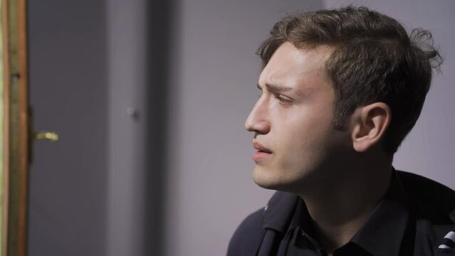 Young man crying sad.
Unhappy man is sad and crying.
