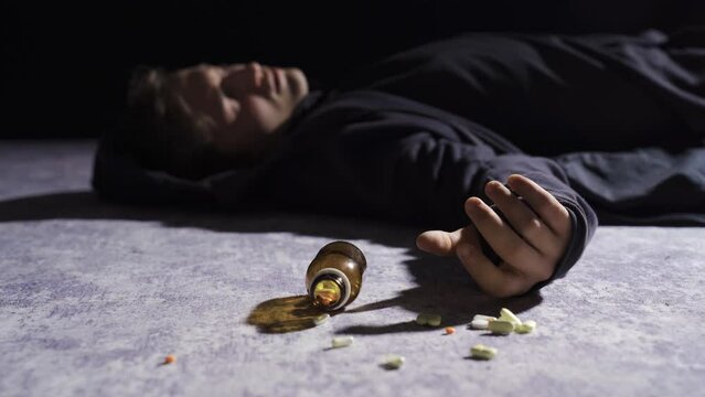 The psychopathic young man committed suicide and passed out.
Suicidal man swallow capsule pills and passed out.
