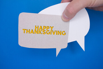 Speech bubble in front of colored background with Thanksgiving text.
