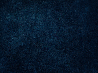 Dark rough cement wall background for graphic design or wallpaper.