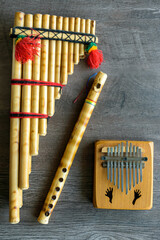 Indigenous musical instruments made of wood. Kalimba, flute and Siku. © Charles Riesco