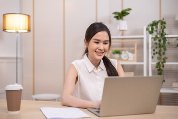 Portrait business woman smile and use tablet checking information .Asian people having online business meeting, video conferencing .