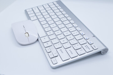 White keyboard and mouse with white background