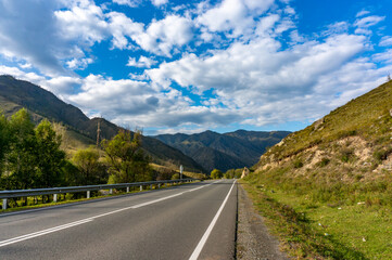 A road surrounded by mountains in the Altai Republic. Gorny Altai