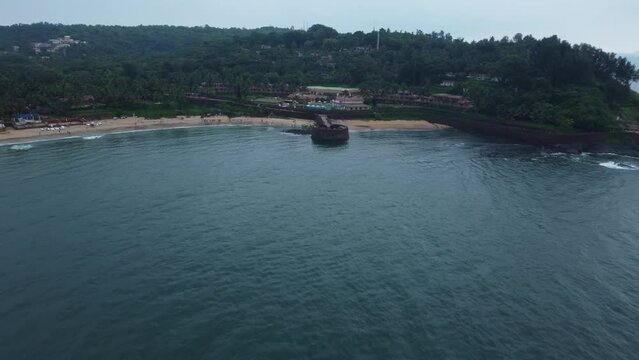 Goa, India 19th October 2022: 4k Drone shots Fort Aguada in North Goa - Seventeenth-century Portuguese fort standing on Sinquerim Beach. Popular also Watersports activities and white sand beach.  