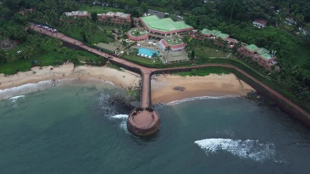 Goa, India 19th October 2022: 4k Drone shots Fort Aguada in North Goa - Seventeenth-century Portuguese fort standing on Sinquerim Beach. Popular also Watersports activities and white sand beach.  