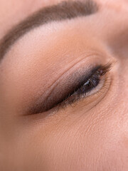 Fototapeta na wymiar permanent eyeliner makeup close up. Healthy and clean skin young woman