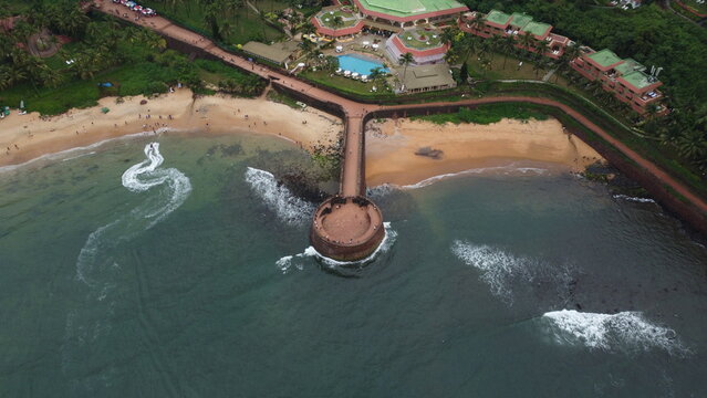 Goa, India 19th October 2022: Drone shots Fort Aguada in North Goa - Seventeenth-century Portuguese fort standing on Sinquerim Beach. Popular also Watersports activities and white sand beach.  