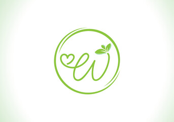 Love healthy and green nutrition leaf logo design with the letters. Green love leaf logo