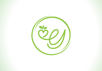 Love healthy and green nutrition leaf logo design with the letters. Green love leaf logo