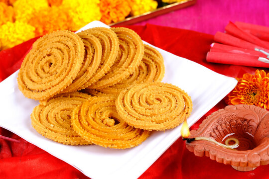 Indian Traditional Snack Chakli, a spiral shaped, Chakali or murukku Indian Traditional Tea Time Snack, Traditional Diwali festival snacks in India.