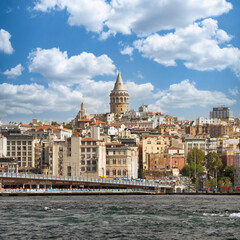 City view of Istanbul skyline, Turkey, from the Bosporous overlooking Galata Bridge with traditional fish restaurants and Galata Tower in the background