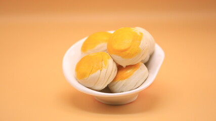 Snacks in the shape of a circle, put in a white plate.