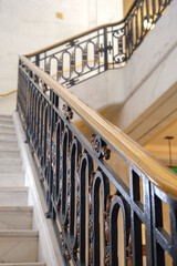 Breathtaking architecture details of panoramic dome columns scenic building interior view with historic walls, chandeliers, brass railings, marble statues in public city hall landmark