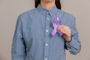Woman holding a purple ribbon in her hands ADD,ADHD,Alzheimer Disease ,Arnold Chiari...