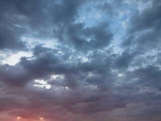 Dramatic twilight sky and clouds background. Dark purple natural sky. Dark clouds, storm and rain. weather and nature concept. Plenty space of text. Full Frame