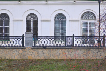 Fragment of the facade of a historic building on an autumn day