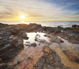 Calm sea at sunset