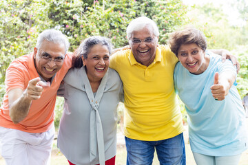 Group of happy senior couple in park