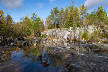 Fototapeta na wymiar Golden autumn in a old marble quarry. Ruskeala mountain park, Karelia. Russia