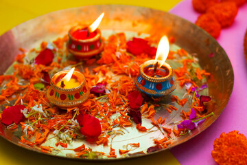 Happy Diwali candle lit with decorative background. 