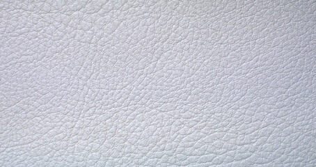 Fototapeta na wymiar Photo of seamless texture of white skin. White background made of leather fabric. Luxury trim for the interior of the car interior.Eco-leather is white.