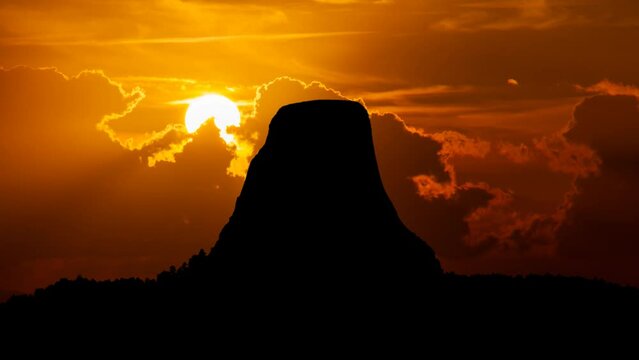 Devils Tower: Time Lapse at Sunset with Red Sun and Fiery Sky, Wyoming, USA