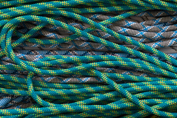 Multicoloured rope for climbing and mountaineering as a pattern, background