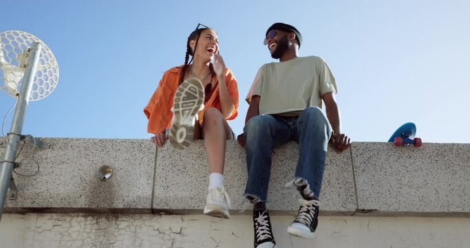 Joke, fashion and wall with young couple hang out on city building together bonding. Interracial stylish young people on a funny city date. Silly, goofy and laughing black man and woman joking