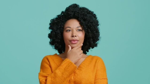 Great idea gesture. Cute African American girl raised index finger up came up with great cool fresh idea, curly hair model looking at camera isolated on pastel blue background, understanding concept