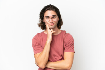 Young handsome man isolated on white background and thinking