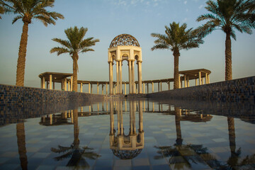 Muslim dome with palms in seaside marina bay Kuwait