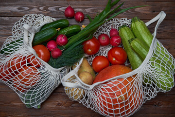 Healthy food vegetables in Eco-friendly packaging reusable bag on wooden table background.