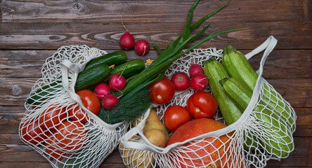 Healthy food vegetables in Eco-friendly packaging reusable bag on wooden table background.