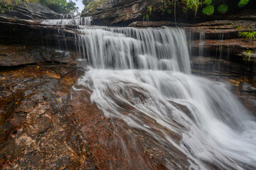 Colombian cascading waterfall in a rock passage