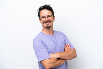 Young man with moustache isolated on white background with arms crossed and looking forward