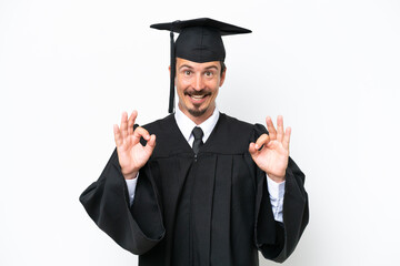 Young university graduate man isolated on white background showing an ok sign with fingers