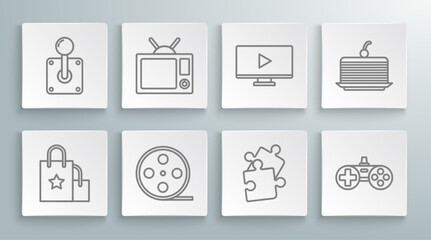 Set line Paper shopping bag, Television, Film reel, Piece of puzzle, Gamepad, Online play video, Cake and Joystick for arcade machine icon. Vector