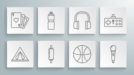 Set line Tourist tent, Fitness shaker, Rolling pin, Basketball ball, Microphone, Headphones, Gamepad and Playing card with heart symbol icon. Vector