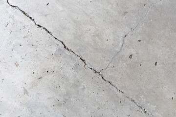 Obraz premium Background of a beautiful concrete wall with oblique wall fractures