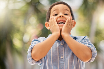 Backyard, portrait and surprised child with a smile playing outdoor in nature at his home. Happy, shocked and wow expression of a boy kid having fun in the garden during summer at his house in Brazil