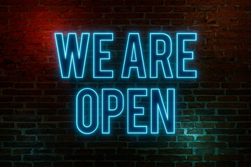 Obraz premium We are open, neon sign. Brick wall at night with the text 