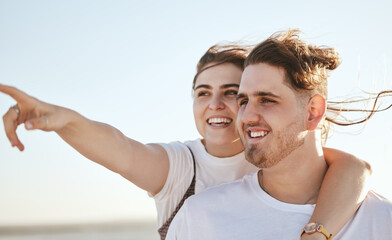 Obraz premium Vacation, view and travel with a normal couple sightseeing while on holiday together during summer. Sky, love and traveling with a real man and woman pointing while outside on a weekend getaway