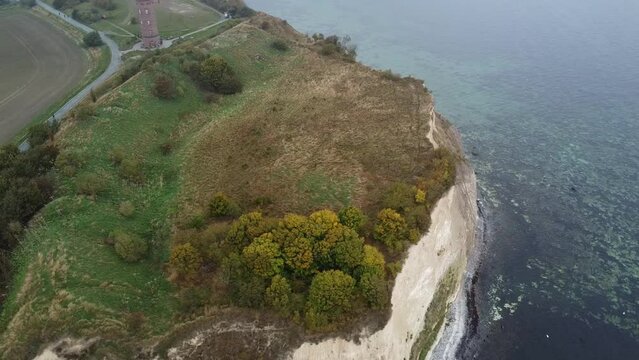 aerial drone shot of Cape Arkona in misty October weather with the archeological digging site "Jaromarsburg" in the foreground. This was a slavic cult site for the god Svantovit