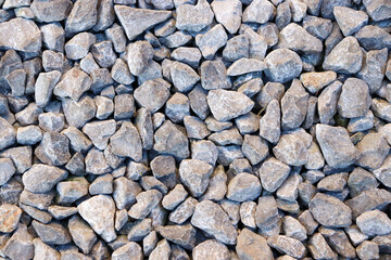 small stone background, light gravel road pebbles stone texture. Abstract background with farden pebbles. Gravel surface