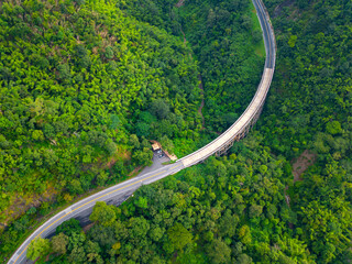 Obraz premium Top view Aerial photo from flying drone over The highest bridge pier Phor Khun Pha Muang Bridge (Huai Tong at Phetchaboon Thailand.Bridge over the jungle.Bridge over mountain and green forest
