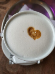 Cup of coffee latte with heart shape