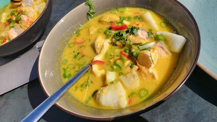 Fish stew, ukha, fish soup on a rustic wooden background. Space for text, top view.