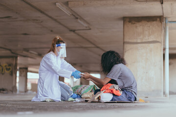 Health workers provide assistance to the homeless. homeless poor people and depression concepts.